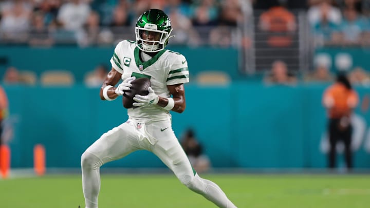 Sep 29, 2025; Miami Gardens, Florida, USA; New York Jets wide receiver Garrett Wilson (5) makes a catch against the Miami Dolphins during the first half at Hard Rock Stadium. Mandatory Credit: Sam Navarro-Imagn Images