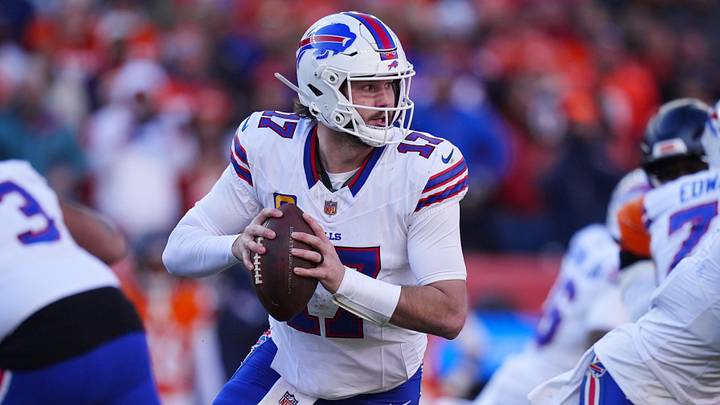 Jan 17, 2026; Denver, CO, USA; Buffalo Bills quarterback Josh Allen (17) rolls out during the second quarter of an AFC Divisional Round playoff game against the Denver Broncos at Empower Field at Mile High. Mandatory Credit: Ron Chenoy-Imagn Images