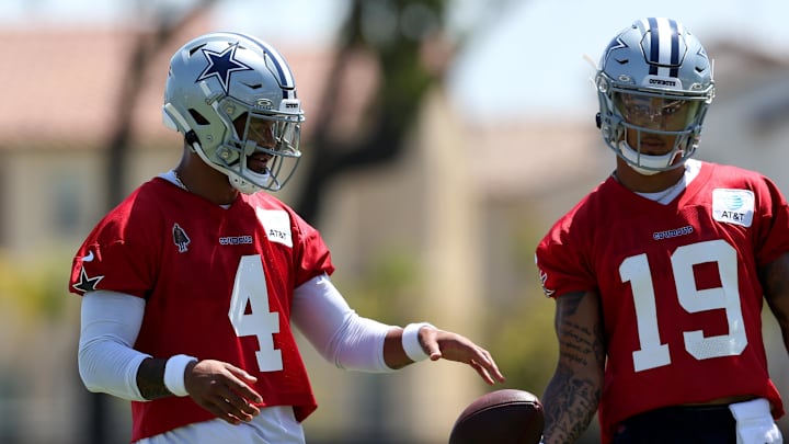Jul 26, 2024; Oxnard, CA, USA; Dallas Cowboys quarterbacks Dak Prescott (4) and Trey Lance (19) during training camp at the River Ridge Playing Fields in Oxnard, California.