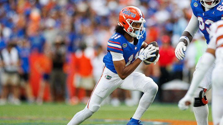 Oct 4, 2025; Gainesville, Florida, USA; Florida Gators wide receiver Aidan Mizell (11) runs with the ball against the Texas Longhorns during the second half at Ben Hill Griffin Stadium. Mandatory Credit: Matt Pendleton-Imagn Images