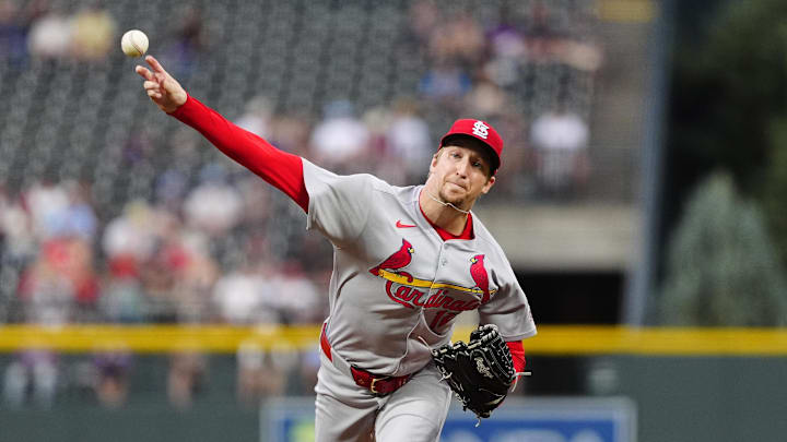 Jul 22, 2025; Denver, Colorado, USA; St. Louis Cardinals starting pitcher Erick Fedde (12) delivers a pitch in the first inning against the Colorado Rockies at Coors Field. Mandatory Credit: Ron Chenoy-Imagn Images
