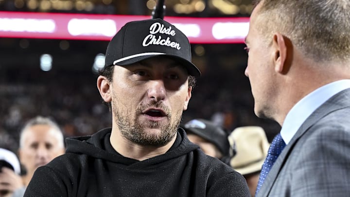 Nov 30, 2024; College Station, Texas, USA; Former Texas A&M and Cleveland Browns quarterback Johnny Manziel speaks with ESPN's College GameDay analyst Kirk Herbstreit prior to the game against the Texas Longhorns. The Longhorns defeated the Aggies 17-7 at Kyle Field. Mandatory Credit: Maria Lysaker-Imagn Images  
