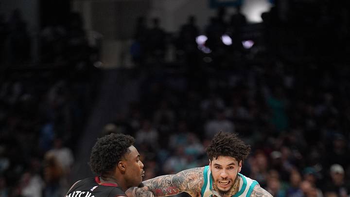 Apr 14, 2026; Charlotte, North Carolina, USA; Charlotte Hornets guard LaMelo Ball (1) moves the ball against Miami Heat guard Davion Mitchell (45) during the second half during the play-in rounds between the Charlotte Hornets and the Miami Heat of the 2026 NBA Playoffs at Spectrum Center. Mandatory Credit: Jim Dedmon-Imagn Images Apr 14, 2026; Charlotte, North Carolina, USA; Charlotte Hornets guard LaMelo Ball (1) moves the ball against Miami Heat guard Davion Mitchell (45) during the second half during the play-in rounds between the Charlotte Hornets and the Miami Heat of the 2026 NBA Playoffs at Spectrum Center. Mandatory Credit: Jim Dedmon-Imagn Images