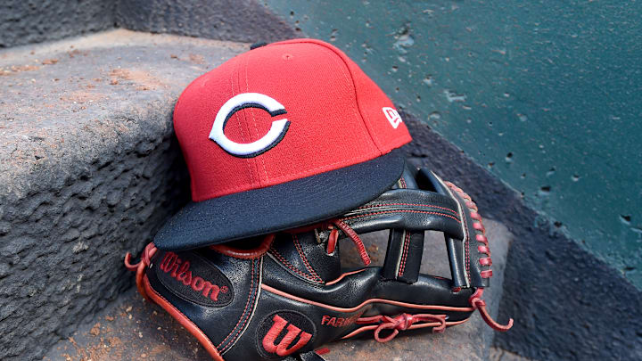 Cincinnati Reds hat and glove.