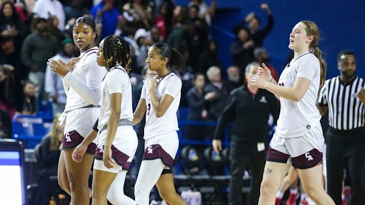 Caravel's (from left) Brycelyn Stryckning, Chasity Wilson, Anaya Price and Jordin Tate head for the bench in a late timeout after surrendering the ball in the final seconds of a tie game in Ursuline's eventual 49-48 win in the DIAA championship at the Bob Carpenter Center, Saturday, March 9, 2024.