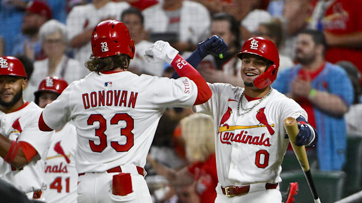 Jul 8, 2025; St. Louis, Missouri, USA;  St. Louis Cardinals left fielder Brendan Donovan (33) celebrates with shortstop Masyn Winn (0) after hitting a two run home run against the Washington Nationals during the third inning at Busch Stadium. Mandatory Credit: Jeff Curry-Imagn Images