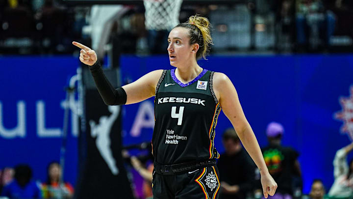 Oct 6, 2024; Uncasville, Connecticut, USA; Connecticut Sun guard Marina Mabrey (4) reacts after her basket against the Minnesota Lynx in the second half during game four of the 2024 WNBA Semi-finals at Mohegan Sun Arena. Mandatory Credit: David Butler II-Imagn Images Oct 6, 2024; Uncasville, Connecticut, USA; Connecticut Sun guard Marina Mabrey (4) reacts after her basket against the Minnesota Lynx in the second half during game four of the 2024 WNBA Semi-finals at Mohegan Sun Arena. Mandatory Credit: David Butler II-Imagn Images