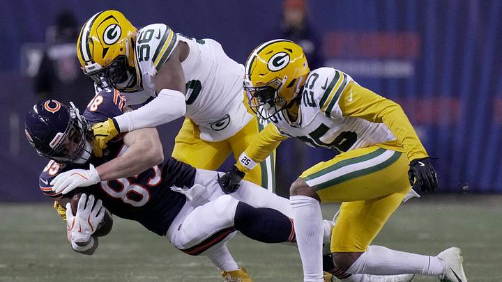 Packers linebacker Edgerrin Cooper (56) tackles Bears tight end Cole Kmet last regular season at Soldier Field. Packers linebacker Edgerrin Cooper (56) tackles Bears tight end Cole Kmet last regular season at Soldier Field.