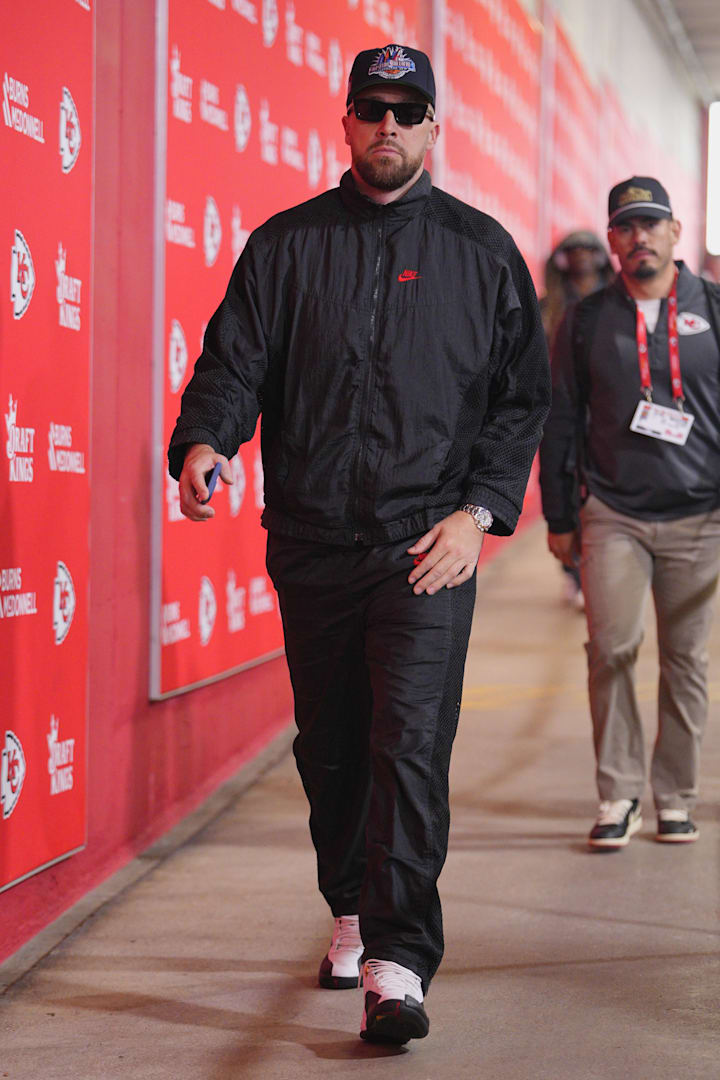 Travis Kelce wears black and red Nike apparel.