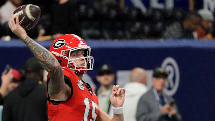 Georgia quarterback Carson Beck (15) warms up before the start of the SEC championship game against Texas in Atlanta, on Saturday, Dec. 7, 2024.