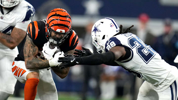 Cincinnati Bengals running back Chase Brown (30) tries to breakthrough the defense of Dallas Cowboys safety Malik Hooker (28) in the 2nd half of Monday Night Football at AT&T Stadium in Arlington,Texas on Monday, December 9, 2024.