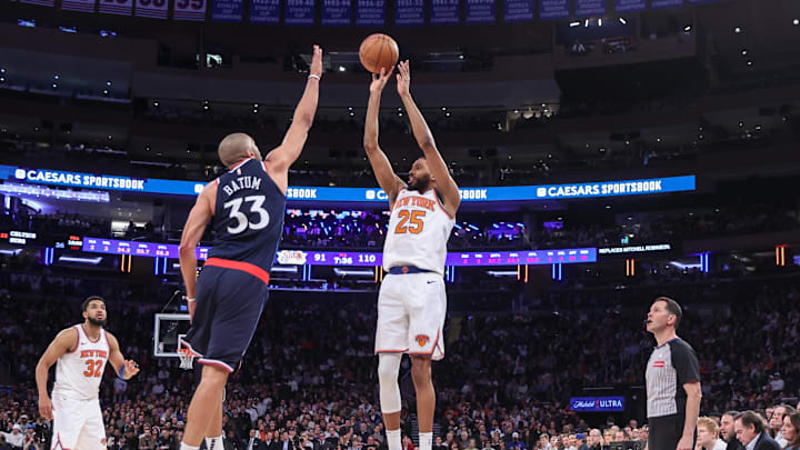 New York Knicks forward Mikal Bridges takes a three point shot past LA Clippers forward Nicolas Batum. Mandatory Credit: Wendell Cruz-Imagn Images