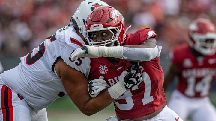 Arkansas Razorbacks defensive lineman Quincy Rhodes rushes in a game against the Arkansas State Red Wolves at War Memorial Stadium in Little Rock, Ark. Arkansas Razorbacks defensive lineman Quincy Rhodes rushes in a game against the Arkansas State Red Wolves at War Memorial Stadium in Little Rock, Ark.