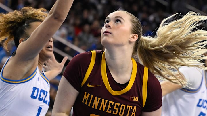 Feb 2, 2025; Los Angeles, California, USA; Minnesota Golden Gophers forward Mallory Heyer (24) drives to the basket past UCLA Bruins guard Kiki Rice (1) during the first quarter at Pauley Pavilion presented by Wescom. Mandatory Credit: Robert Hanashiro-Imagn Images