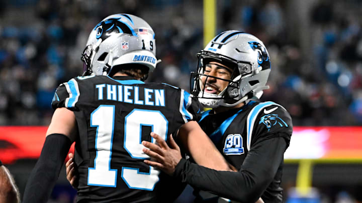 Dec 1, 2024; Charlotte, North Carolina, USA; Carolina Panthers wide receiver Adam Thielen (19) celebrates with quarterback Bryce Young (9) after scoring a touchdown with 30 seconds left in the fourth quarter at Bank of America Stadium. Mandatory Credit: Bob Donnan-Imagn Images Dec 1, 2024; Charlotte, North Carolina, USA; Carolina Panthers wide receiver Adam Thielen (19) celebrates with quarterback Bryce Young (9) after scoring a touchdown with 30 seconds left in the fourth quarter at Bank of America Stadium. Mandatory Credit: Bob Donnan-Imagn Images