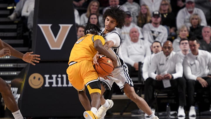 Mar 1, 2025; Nashville, Tennessee, USA; Vanderbilt Commodores guard Tyler Tanner (3) steals the ball from Missouri Tigers guard Anthony Robinson II (0) during the first half at Memorial Gymnasium. Mandatory Credit: Steve Roberts-Imagn Images Mar 1, 2025; Nashville, Tennessee, USA; Vanderbilt Commodores guard Tyler Tanner (3) steals the ball from Missouri Tigers guard Anthony Robinson II (0) during the first half at Memorial Gymnasium. Mandatory Credit: Steve Roberts-Imagn Images