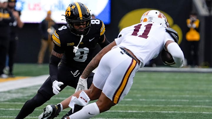 Iowa Hawkeyes defensive back Deshaun Lee (8) defends Minnesota Golden Gophers wide receiver Javon Tracy (11) Oct. 25, 2025 at Kinnick Stadium in Iowa City, Iowa.