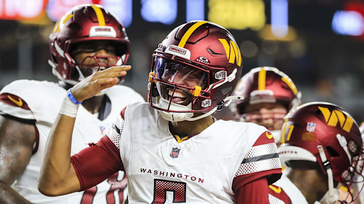 Washington Commanders quarterback Jayden Daniels reacts after scoring a touchdown against the Cincinnati Bengals. Washington Commanders quarterback Jayden Daniels reacts after scoring a touchdown against the Cincinnati Bengals.