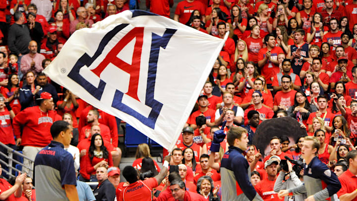 Jan 16, 2014; Tucson, AZ, USA; An Arizona Wildcats flag is waved before the first half against the Arizona State Sun Devils at McKale Center. Arizona won 91-68. Mandatory Credit: Casey Sapio-Imagn Images