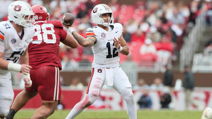 Oct 25, 2025; Fayetteville, Arkansas, USA; Auburn Tigers quarterback Ashton Daniels (12) passes during the fourth quarter against the Arkansas Razorbacks at Donald W. Reynolds Razorback Stadium. Mandatory Credit: Nelson Chenault-Imagn Images Oct 25, 2025; Fayetteville, Arkansas, USA; Auburn Tigers quarterback Ashton Daniels (12) passes during the fourth quarter against the Arkansas Razorbacks at Donald W. Reynolds Razorback Stadium. Mandatory Credit: Nelson Chenault-Imagn Images