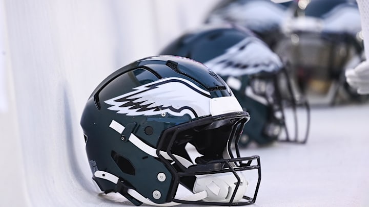 Philadelphia Eagles helmets sit on the bench.