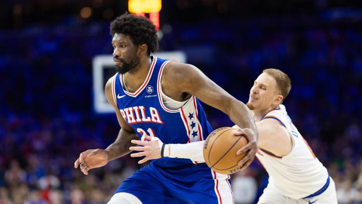 May 2, 2024; Philadelphia, Pennsylvania, USA; Philadelphia 76ers center Joel Embiid (21) drives against New York Knicks guard Donte DiVincenzo (0) during the second half of game six of the first round for the 2024 NBA playoffs at Wells Fargo Center. Mandatory Credit: Bill Streicher-USA TODAY Sports
