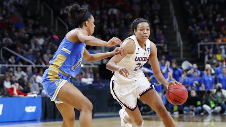 UConn Huskies forward drives to the basket as UCLA Bruins forward 