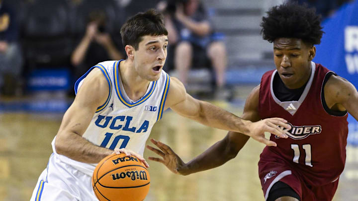 Nov 4, 2024; Los Angeles, California, USA; UCLA Bruins guard Lazar Stefanovic (10) drives to the basket as Rider Broncs guard Flash Burton (11) moves in to defend during the second half at Pauley Pavilion presented by Wescom. Mandatory Credit: Robert Hanashiro-Imagn Images