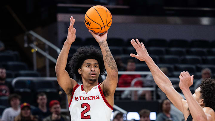 Mar 12, 2025; Indianapolis, IN, USA; Rutgers Scarlet Knights guard Dylan Harper (2) shoots the ball while USC Trojans guard Desmond Claude (1) defends in the second half at Gainbridge Fieldhouse. Mandatory Credit: Trevor Ruszkowski-Imagn Images