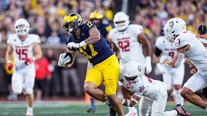 Michigan tight end Marlin Klein (17) makes a catch against New Mexico safety Austin Brawley (21) during the first half at Michigan Stadium in Ann Arbor on Saturday, August 30, 2025.
