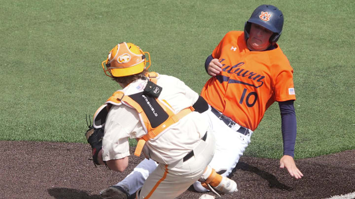 Tennessee's Cannon Peebles (5) tags out Auburn's Lucas Steele (10) at home plate during game 3 of their NCAA baseball game series on May 4, 2025, in Knoxville, Tenn.