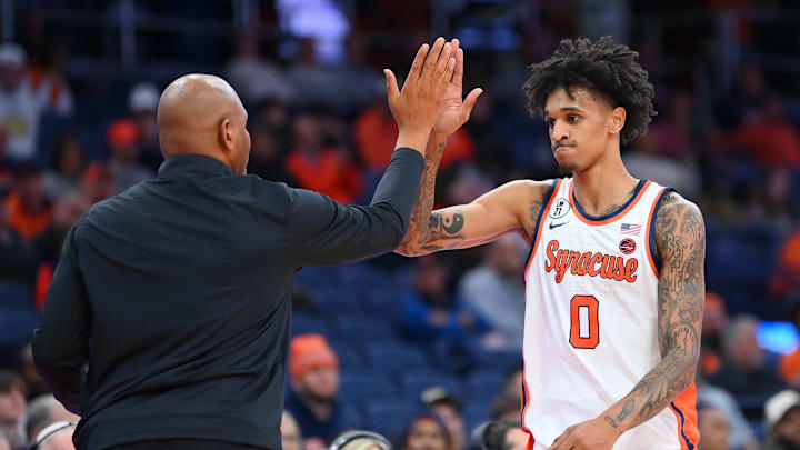 Nov 18, 2025; Syracuse, New York, USA; Syracuse Orange head coach Adrian Autry (left) greets forward Sadiq White Jr. (0) after fouling out of the game against the Monmouth Hawks during the second half at the JMA Wireless Dome. Mandatory Credit: Rich Barnes-Imagn Images