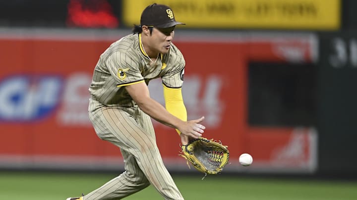 Jul 26, 2024; Baltimore, Maryland, USA;  San Diego Padres shortstop Ha-Seong Kim (7) fields a eighth inning ground ball against the Baltimore Orioles at Oriole Park at Camden Yards. Mandatory Credit: Tommy Gilligan-Imagn Images