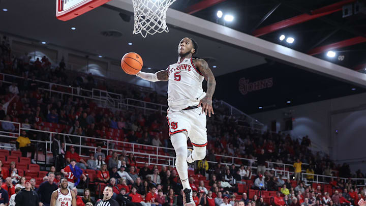 Dec 28, 2024; Queens, New York, USA; St. John's basketball guard Deivon Smith (5) goes up for a dunk attempt in the second half against the Delaware Fightin Blue Hens at Carnesecca Arena.
