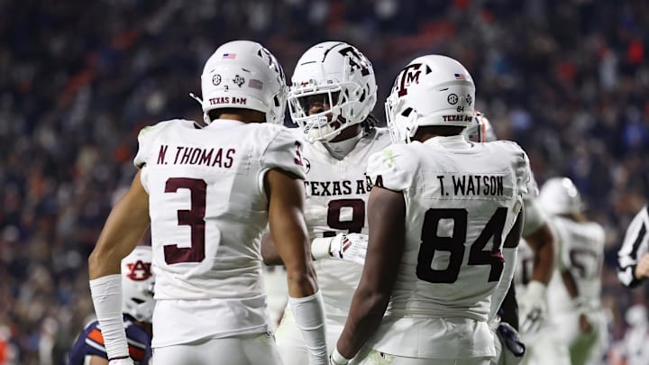 Nov 23, 2024; Auburn, Alabama, USA; Texas A&M Aggies wide receiver Jahdae Walker (9) celebrates with wide receiver Noah Thomas (3) and tight end Tre Watson (84) after scoring in the first overtime against the Auburn Tigers at Jordan-Hare Stadium. Mandatory Credit: John Reed-Imagn Images Nov 23, 2024; Auburn, Alabama, USA; Texas A&M Aggies wide receiver Jahdae Walker (9) celebrates with wide receiver Noah Thomas (3) and tight end Tre Watson (84) after scoring in the first overtime against the Auburn Tigers at Jordan-Hare Stadium. Mandatory Credit: John Reed-Imagn Images