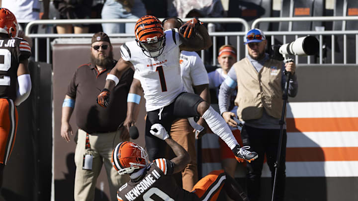 Oct 20, 2024; Cleveland, Ohio, USA; Cincinnati Bengals wide receiver Ja'Marr Chase (1) celebrates his touchdown over Cleveland Browns cornerback Greg Newsome II (0) during the third quarter at Huntington Bank Field. Mandatory Credit: Scott Galvin-Imagn Images