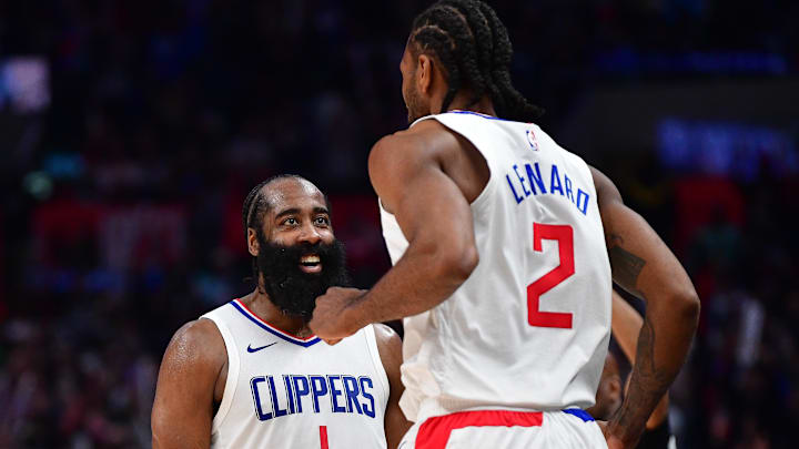 Jan 21, 2024; Los Angeles, California, USA; Los Angeles Clippers guard James Harden (1) reacts after forward Kawhi Leonard (2) scores three point basket against the Brooklyn Nets during the second half at Crypto.com Arena. Mandatory Credit: Gary A. Vasquez-USA TODAY Sports