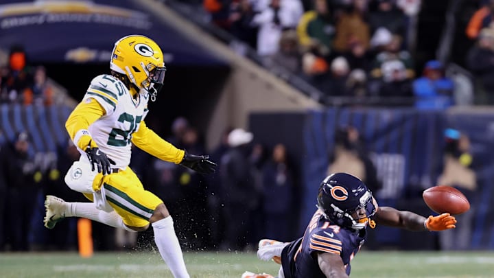 Dec 20, 2025; Chicago, Illinois, USA; A pass thrown by Chicago Bears quarterback Caleb Williams (not pictured) intended for wide receiver Olamide Zaccheaus (14) falls incomplete against Green Bay Packers cornerback Keisean Nixon (25) during overtime at Soldier Field. Mandatory Credit: Mike Dinovo-Imagn Images