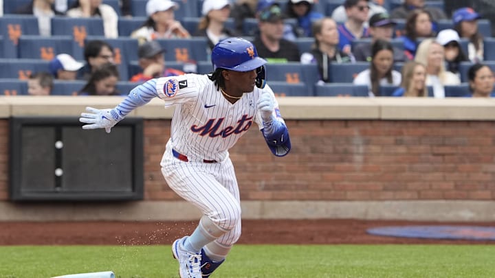 Jun 15, 2025; New York City, New York, USA;  New York Mets shortstop Luisangel Acuna (2) runs out a single against the Tampa Bay Rays during the third inning at Citi Field. Mandatory Credit: Gregory Fisher-Imagn Images