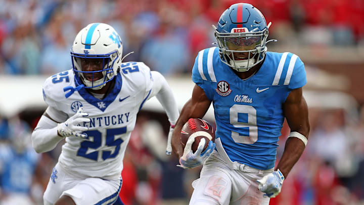 Sep 28, 2024; Oxford, Mississippi, USA; Mississippi Rebels wide receiver Tre Harris (9) runs after a catch for a first down as Kentucky Wildcats defensive back Jordan Lovett (25) pursues during the second half at Vaught-Hemingway Stadium. Mandatory Credit: Petre Thomas-Imagn Images Sep 28, 2024; Oxford, Mississippi, USA; Mississippi Rebels wide receiver Tre Harris (9) runs after a catch for a first down as Kentucky Wildcats defensive back Jordan Lovett (25) pursues during the second half at Vaught-Hemingway Stadium. Mandatory Credit: Petre Thomas-Imagn Images