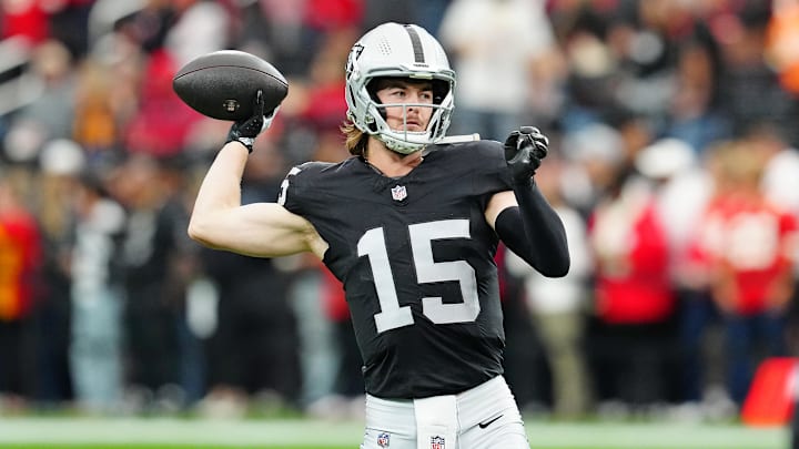 Las Vegas Raiders quarterback Kenny Pickett (15) warms up before a game against the Kansas City Chiefs