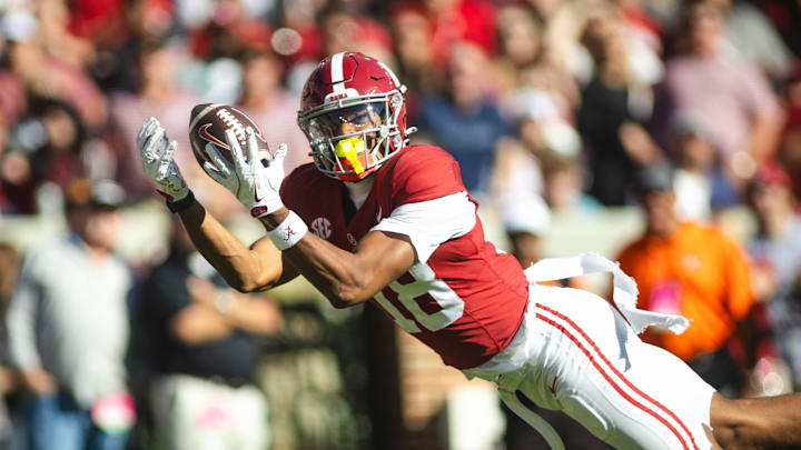 Nov 16, 2024; Tuscaloosa, Alabama, USA; Alabama Crimson Tide wide receiver Caleb Odom (18) dives in an attempt to complete a pass agains the Mercer Bears during the first quarter at Bryant-Denny Stadium. Mandatory Credit: Will McLelland-Imagn Images Nov 16, 2024; Tuscaloosa, Alabama, USA; Alabama Crimson Tide wide receiver Caleb Odom (18) dives in an attempt to complete a pass agains the Mercer Bears during the first quarter at Bryant-Denny Stadium. Mandatory Credit: Will McLelland-Imagn Images