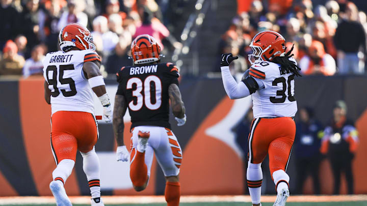 Jan 4, 2026; Cincinnati, Ohio, USA; Cleveland Browns linebacker Devin Bush (30) returns an interception for a touchdown against the Cincinnati Bengals during the first quarter at Paycor Stadium. Mandatory Credit: Katie Stratman-Imagn Images