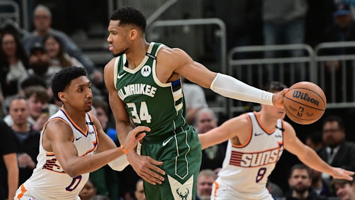Apr 1, 2025; Milwaukee, Wisconsin, USA;  Milwaukee Bucks forward Giannis Antetokounmpo (34) looks for a shot against Phoenix Suns guard Ryan Dunn (0) in the first quarter at Fiserv Forum. Mandatory Credit: Benny Sieu-Imagn Images