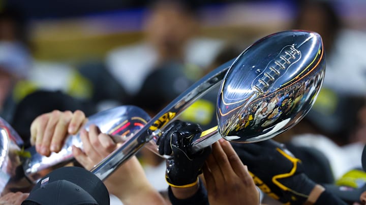 Dec 29, 2023; Arlington, TX, USA; The Cotton Bowl trophy gets passed around by Missouri Tigers players after the game against the Ohio State Buckeyes at AT&T Stadium. Mandatory Credit: Kevin Jairaj-Imagn Images Dec 29, 2023; Arlington, TX, USA; The Cotton Bowl trophy gets passed around by Missouri Tigers players after the game against the Ohio State Buckeyes at AT&T Stadium. Mandatory Credit: Kevin Jairaj-Imagn Images