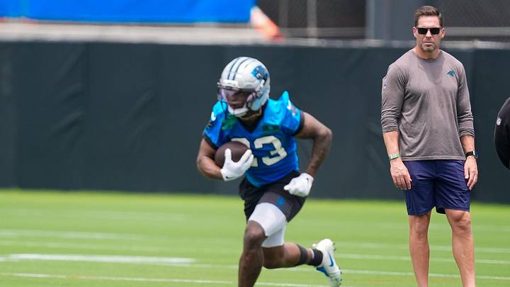 Jun 9, 2026; Charlotte, NC, USA; Team Manager Dan Morgan watches running back Trevor Etienne (23) during the first day of mini camp at Bank of America Stadium practice facility. Mandatory Credit: Jim Dedmon-Imagn Images Jun 9, 2026; Charlotte, NC, USA; Team Manager Dan Morgan watches running back Trevor Etienne (23) during the first day of mini camp at Bank of America Stadium practice facility. Mandatory Credit: Jim Dedmon-Imagn Images