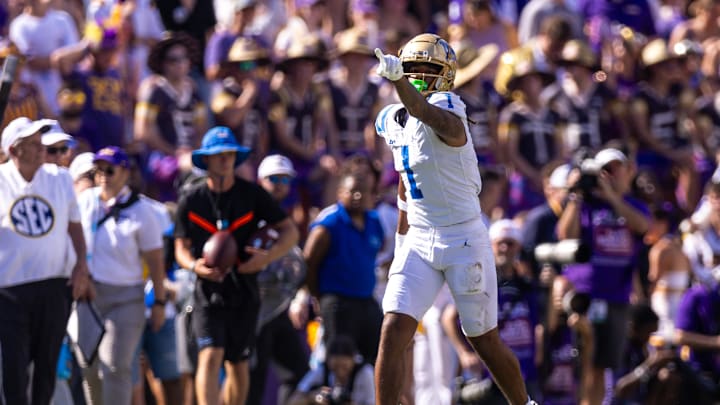 Sep 21, 2024; Baton Rouge, Louisiana, USA; UCLA Bruins wide receiver Rico Flores Jr. (1) reacts after making a first down against LSU Tigers cornerback Ashton Stamps (1) during the first half at Tiger Stadium. Mandatory Credit: Stephen Lew-Imagn Images Sep 21, 2024; Baton Rouge, Louisiana, USA; UCLA Bruins wide receiver Rico Flores Jr. (1) reacts after making a first down against LSU Tigers cornerback Ashton Stamps (1) during the first half at Tiger Stadium. Mandatory Credit: Stephen Lew-Imagn Images