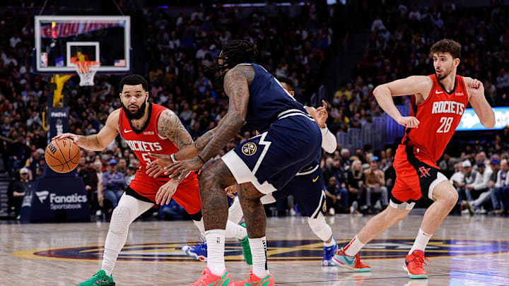Jan 15, 2025; Denver, Colorado, USA; Houston Rockets guard Fred VanVleet (5) controls the ball against Denver Nuggets center DeAndre Jordan (6) as center Alperen Sengun (28) defends in the second quarter at Ball Arena. Mandatory Credit: Isaiah J. Downing-Imagn Images