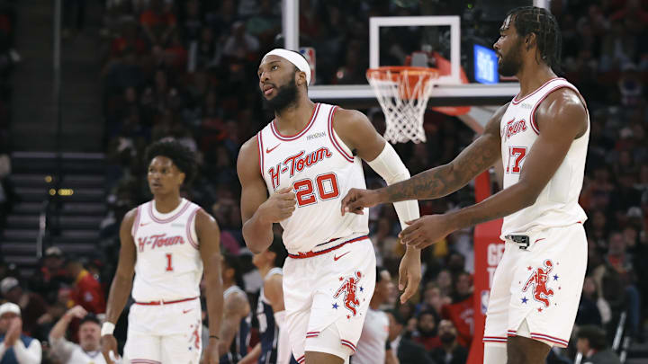 Jan 31, 2026; Houston, Texas, USA; Houston Rockets guard Josh Okogie (20) reacts with forward Tari Eason (17) after a play during the second half against the Dallas Mavericks at Toyota Center. Mandatory Credit: Troy Taormina-Imagn Images