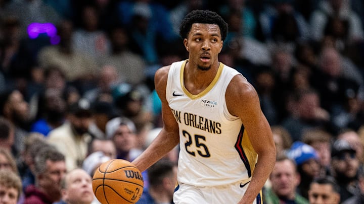 Jan 25, 2025; Charlotte, North Carolina, USA; New Orleans Pelicans guard Trey Murphy III (25) brings the ball up court against the Charlotte Hornets during the third quarter at Spectrum Center. Mandatory Credit: Scott Kinser-Imagn Images